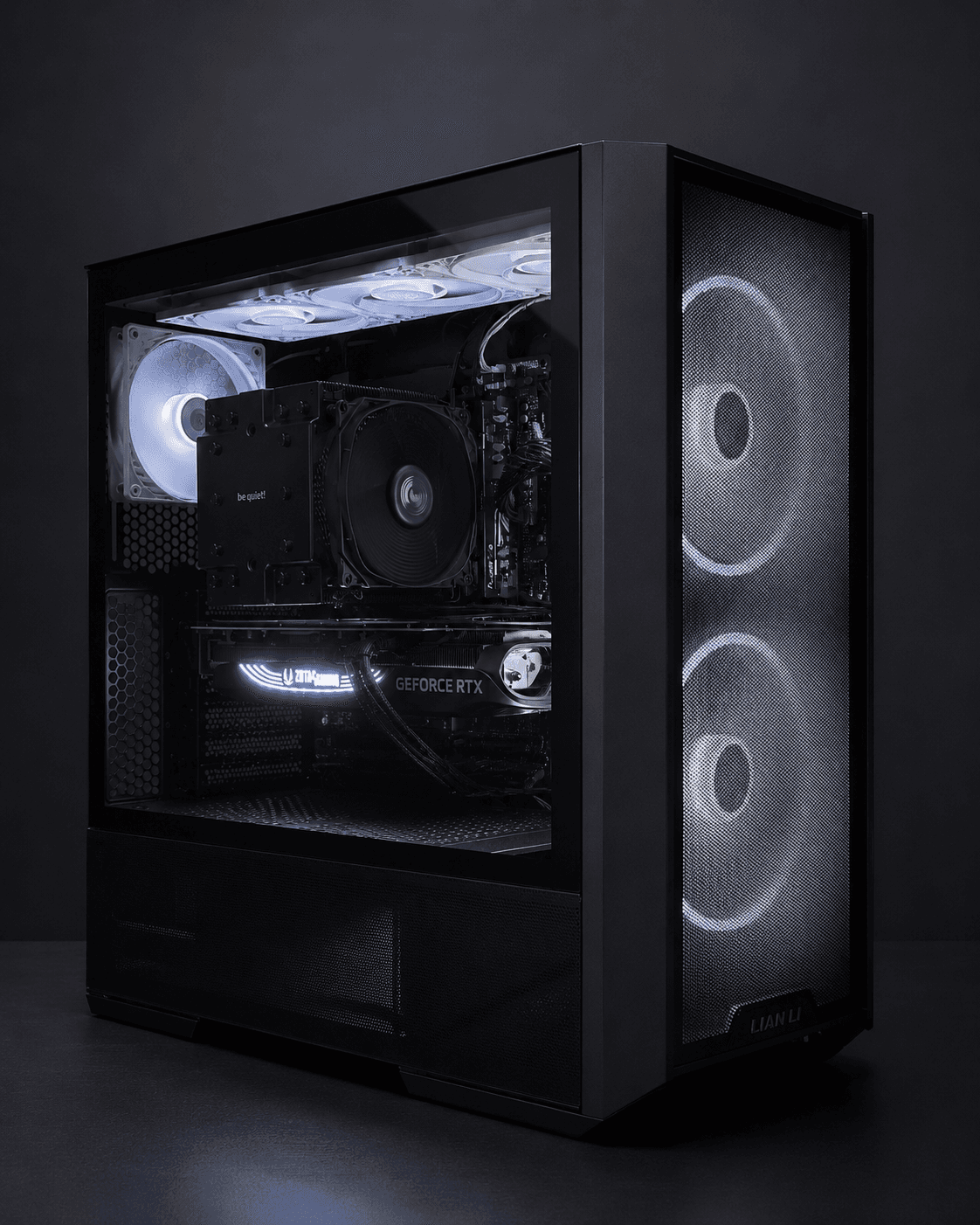 Black Lian Li airflow-style PC with white-lit fans, be quiet tower air cooler, and Zotac GeForce RTX graphics card